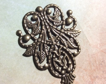 Ornate filigree bronze metal embellishments