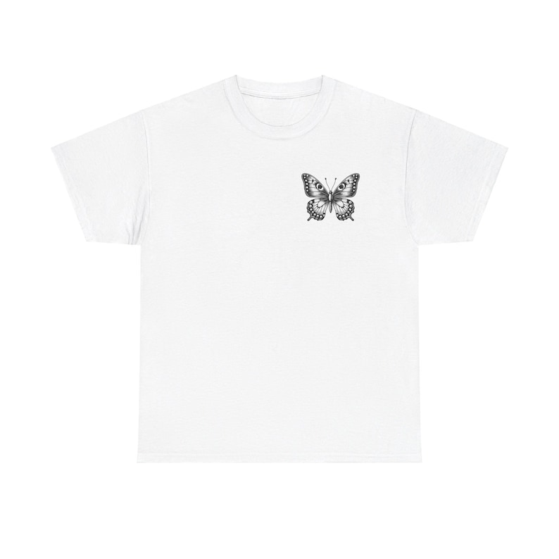 May include: White t-shirt with a black and white butterfly graphic on the front.