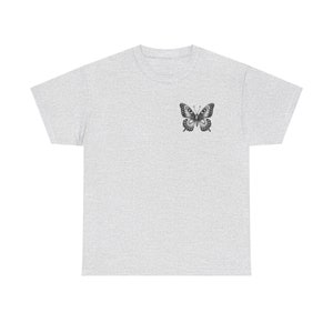 May include: A heather grey t-shirt with a black and white butterfly graphic on the left chest.