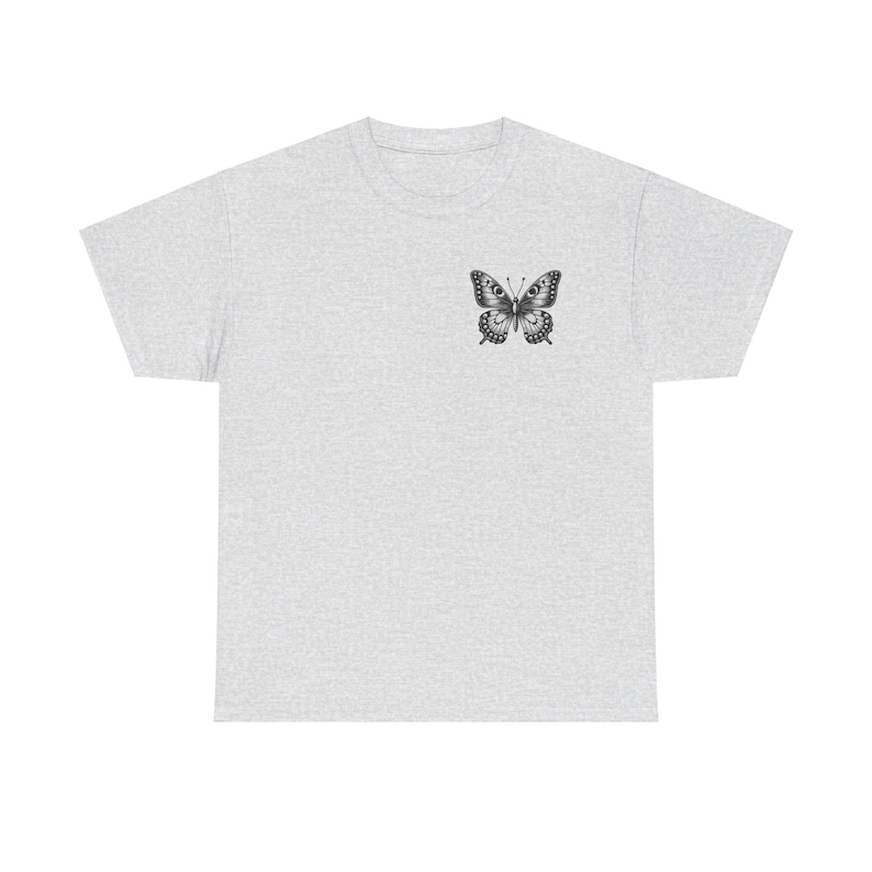May include: A heather grey t-shirt with a black and white butterfly graphic on the left chest.