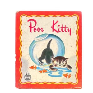May include: Vintage children's book titled "Poor Kitty." The cover features a red border with a yellow trim. The illustration shows a kitten inside a fishbowl and another kitten outside, with orange fish.