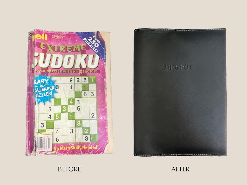May include: A pink and green book with the title "Extreme Sudoku" and the text "Over 250 Puzzles!"  The book is open to a page with a Sudoku puzzle.  The book is next to a black leather-bound book with the word "Sudoku" embossed on the front.