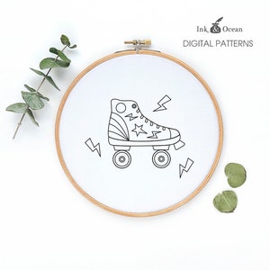 May include: Black and white line drawing of a roller skate with lightning bolts. The roller skate has a star and stripes design on the boot. The image is in a hoop.