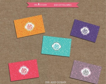 May include: Five colorful Eid envelopes with intricate patterns and Arabic calligraphy. The envelopes are in orange, turquoise, purple, pink, and red.