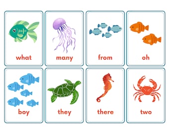 May include: Set of eight flashcards featuring aquatic animals like fish, jellyfish, and a crab. Each card has a colorful illustration and a word at the bottom. The words include "what", "many", "from", "oh", "boy", "they", "there", and "two".