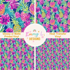 May include: A seamless pattern featuring pink hibiscus flowers and green pineapple fruit on a dark blue background. The text "Glossy or Matte Printed Vinyl" and "Heat Transfer Vinyl" is included in the image. The text "Emmy L. Designs" is also included in the image.