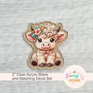 May include: A clear acrylic blank and matching decal set featuring a cartoon Highland cow. The cow is light beige with a pink bow, flower crown, and large eyes. The text reads "2" Clear Acrylic Blank and Matching Decal Set".