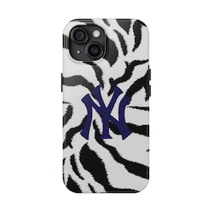 May include: A black and white zebra print phone case with a blue New York Yankees logo.