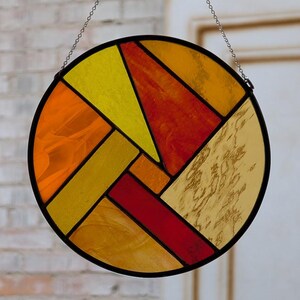 Atrapasol con vibrantes "signos de fuego"