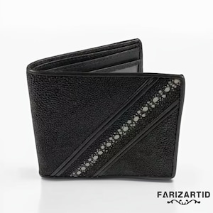 May include: A black leather wallet with a textured surface and a white patterned design. The wallet has a fold-over closure and a flap with a stitched edge.