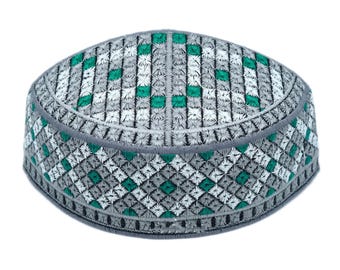 May include: A gray and green embroidered skullcap with a diamond pattern.