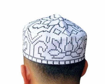 May include: White skullcap with a black geometric pattern. The skullcap is made of a soft, breathable fabric.