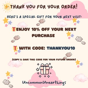 May include: A pink and white illustration of a gift box with stars and clouds. The text reads "THANK YOU FOR YOUR ORDER! HERE'S A SPECIAL GIFT FOR YOUR NEXT VISIT: ENJOY 10% OFF YOUR NEXT PURCHASE WITH CODE: THANKYOU10 (COPY & SAVE THIS CODE FOR YOUR FUTURE ORDER!) Uncommon Unearthings"