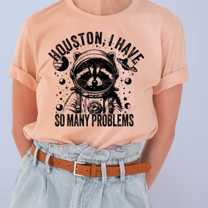 Funny Raccoon Astronaut T-Shirt: Retro 90s Graphic Tee