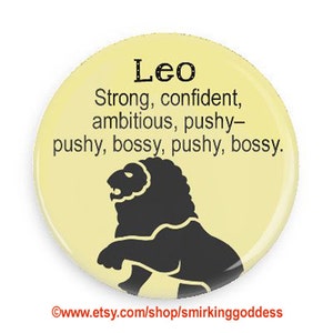 May include: A yellow button with a black lion illustration and the text "Leo Strong, confident, ambitious, pushy-pushy, bossy, pushy, bossy."