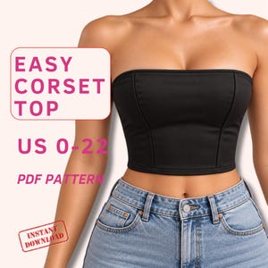 May include: A black strapless corset top with vertical seam detailing, paired with light blue denim jeans. The image includes text that reads EASY CORSET TOP, US 0-22, PDF PATTERN, and INSTANT DOWNLOAD in pink and red lettering.