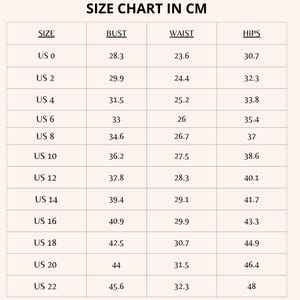 May include: Size chart in centimeters for clothing sizes US 0 to US 22. The chart lists bust, waist, and hip measurements in centimeters.