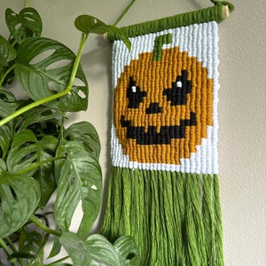 Handmade Pixel Jack-O&#39;-Lantern Macrame Wall Hanging: Halloween Decor