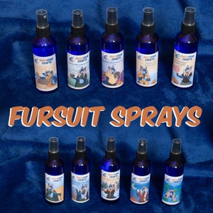 May include: Ten small blue spray bottles with various colorful labels featuring cartoon animal characters. The labels include text that reads "Awesome Crafts" and the scent of each spray. The bottles are arranged in two rows of five on a blue fuzzy surface. The text "FURSUIT SPRAYS" is printed in orange letters below the bottles.