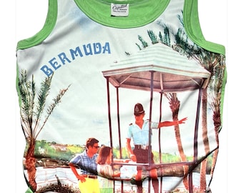 May include: Green tank top with a white background featuring a vintage photograph of a police officer directing tourists in Bermuda. The text "BERMUDA" is printed in blue on the front of the tank top.
