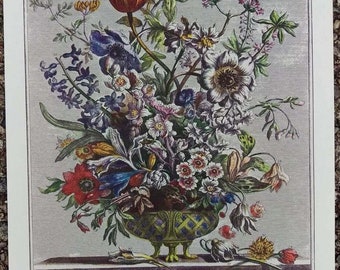 May include: A vintage botanical illustration of a bouquet of flowers in a green and gold vase. The flowers include tulips, irises, and other blooms in shades of pink, purple, red, yellow, and white. The illustration is labeled "February" and numbered "99".