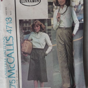 May include: A vintage sewing pattern envelope for a women's blouse, skirt, and pants. The pattern is from McCall's and is number 4713. The envelope is white with a brown and white photo of a woman wearing the outfit. The text on the envelope reads "$1.75 McCall's 4713" and "Carefree Patterns".