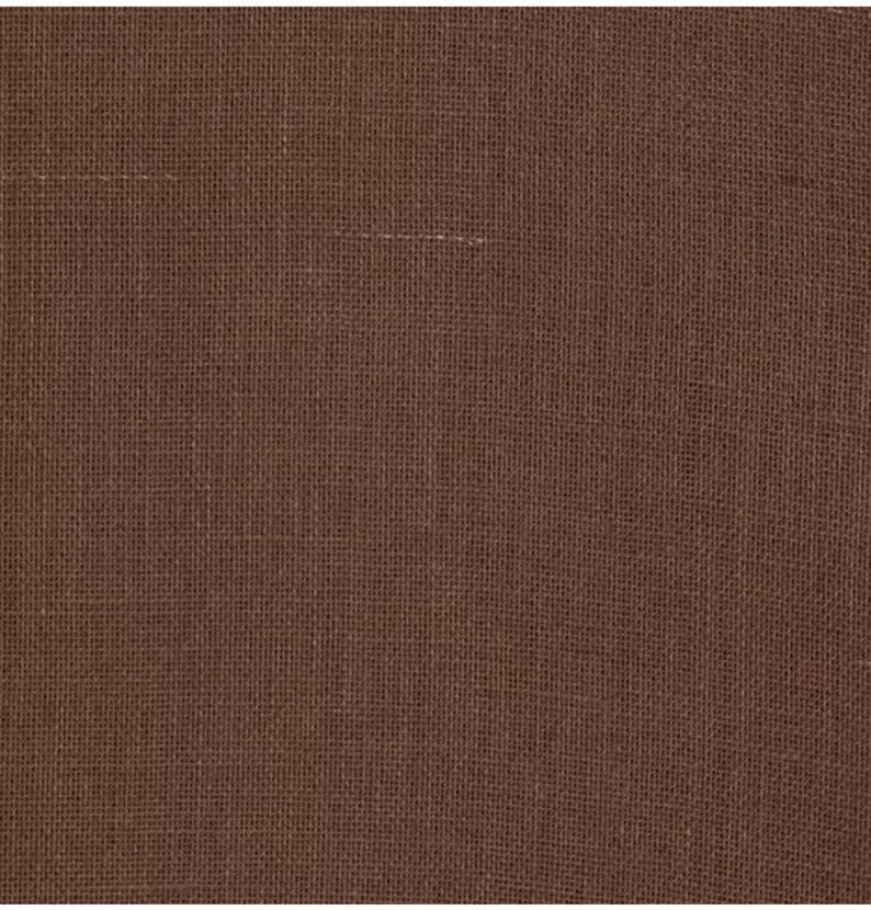Puede incluir: Primer plano de una tela marr&oacute;n con textura tejida.
