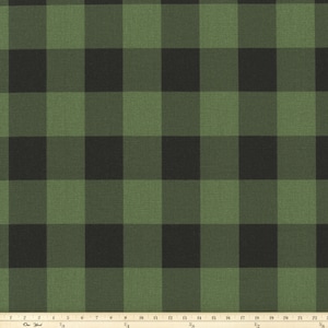 May include: Green and black plaid fabric with a woven texture.