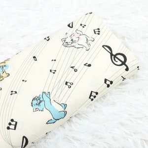 6038 - Cat Playing with Music Notes Cotton Fabric - 55 Inch (Width) x 1/2 Yard (Length)
