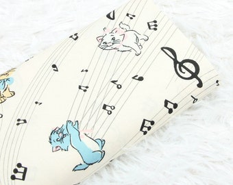 6038 - Cat Playing with Music Notes Cotton Fabric - 55 Inch (Width) x 1/2 Yard (Length)