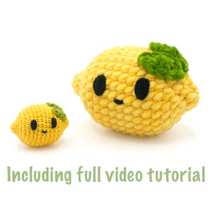 May include: Two crocheted lemons, one large and one small, in shades of yellow. The lemons have black eyes and smiling mouths. The larger lemon has a green leaf detail. The text "Including full video tutorial" is at the bottom.