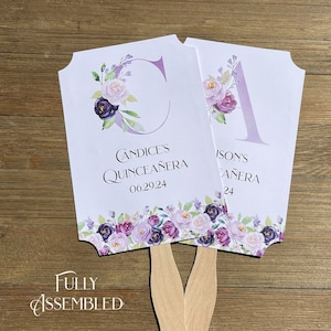 Elegant Quinceanera favor fans adorned with lavender flowers and monogram.  Personalized fans for the guest of honor, a wonderful keepsake.