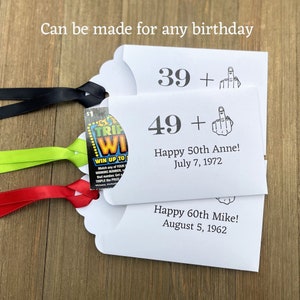 Funny adult birthday party favors for that dreaded milestone.  Personalized birthday lotto ticket favors, slide a scratch off inside.