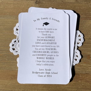 Graduation party thank you printed on white card stock.  Each personalized card can be rolled up and tied with ribbon to look like a graduation diploma favor.  Or just a nice thank you to place on each place setting.