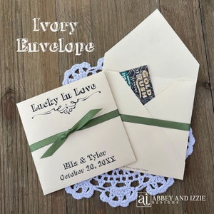 Lucky in love lottery ticket envelopes for wedding favors.  Slide a lotto ticket in these personalized envelopes for a fun favor.  Your choice of envelope and ribbon color, ribbon included and comes attached.  Easy and fun wedding guest favors.