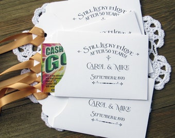 Our 50th wedding anniversary favors are personalized, gold ribbon comes attached.  Slide a lotto ticket in for a fun anniversary favor.
