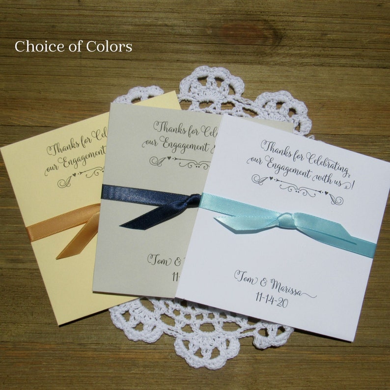 Unique engagement party favors, personalized for the bride and groom.  Fill each with a gift card or lottery ticket to thank your guests for celebrating with you.  Your choice of envelope and ribbon color to match your theme.