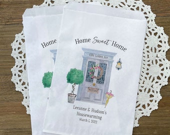 Housewarming favor bags, personalized with the new address and names of the new homeowners.