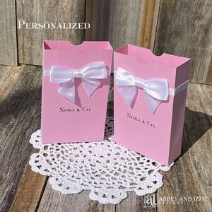 Pink favor boxes, personalized for the guest of honor.  Perfect for baby showers, bridal showers, sweet 16, quinceanera or birthday favors.