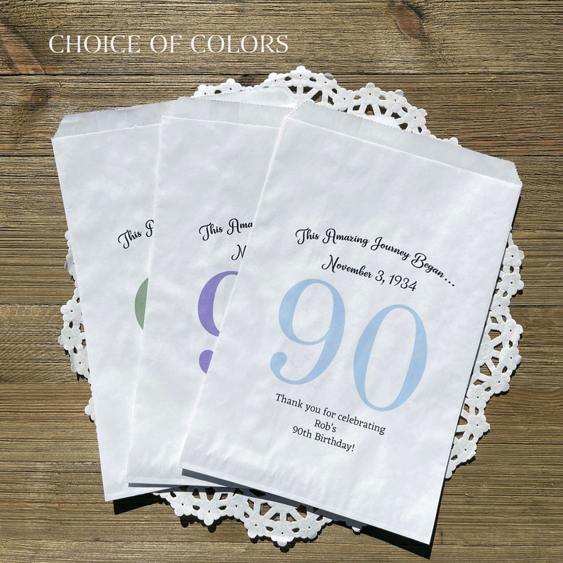 Personalized 90th birthday favor bags, printed on white bags, your choice of number color.  Bags are personalized with large birthday number, name of guest of honor along with birth date.  Adult favor bags perfect for many treats to thank your guests