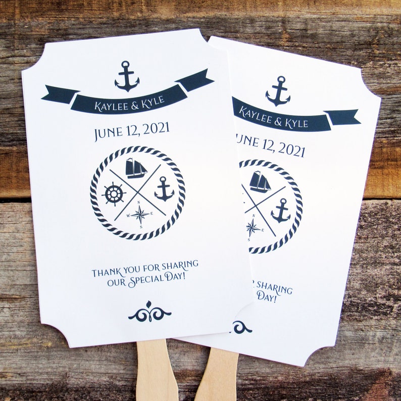 Nautical wedding fans, printed on white card stock with navy text and details.  Fans are personalized for the bride and groom with names and date.  Fans are shipped fully assembled, two sided with hand hidden between.
