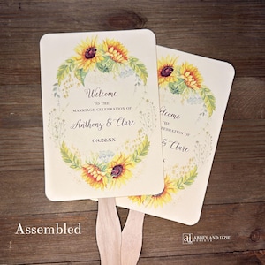 Sunflower wedding fans , personalized for the bride and groom and adorned with a ring of sunflowers.  Fans are printed on ivory or white cardstock, two sided so handle is hidden between.  Wedding fans ship fully assembled and ready for your big day.