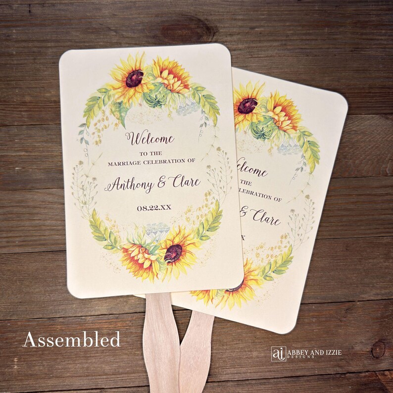 Sunflower wedding fans , personalized for the bride and groom and adorned with a ring of sunflowers.  Fans are printed on ivory or white cardstock, two sided so handle is hidden between.  Wedding fans ship fully assembled and ready for your big day.