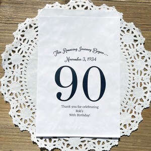 Personalized 90th birthday favor bags, printed on white bags, your choice of number color.  Bags are personalized with large birthday number, name of guest of honor along with birth date.  Adult favor bags perfect for many treats to thank your guests