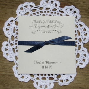 Unique engagement party favors, personalized for the bride and groom.  Fill each with a gift card or lottery ticket to thank your guests for celebrating with you.  Your choice of envelope and ribbon color to match your theme.