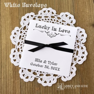 Lucky in love lottery ticket envelopes for wedding favors.  Slide a lotto ticket in these personalized envelopes for a fun favor.  Your choice of envelope and ribbon color, ribbon included and comes attached.  Easy and fun wedding guest favors.