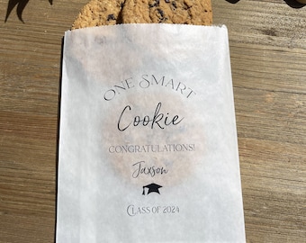 Graduation cookie bags that come personalized for the graduate.  Glassine bags, stuff with cookies or perfect for cookie bar bags.