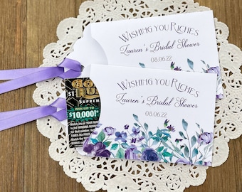 Lotto ticket bridal shower favors adorned with lavender flowers and ribbon.  Personalized fun bridal shower favors lavender floral.