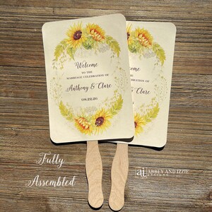Sunflower wedding fans personalized for the bride and groom.  Wedding favor fans come fully assembled, wooden handle hidden.