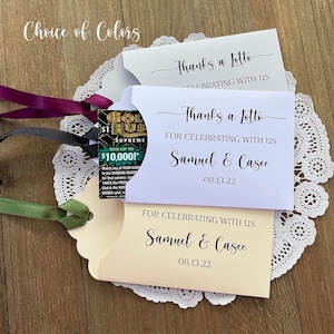Thanks a lotto wedding favors, slide a lottery ticket in these cute envelopes to see who wins.  Personalized wedding guest favors, fun!